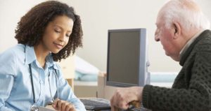 Doctor talking to elderly patient