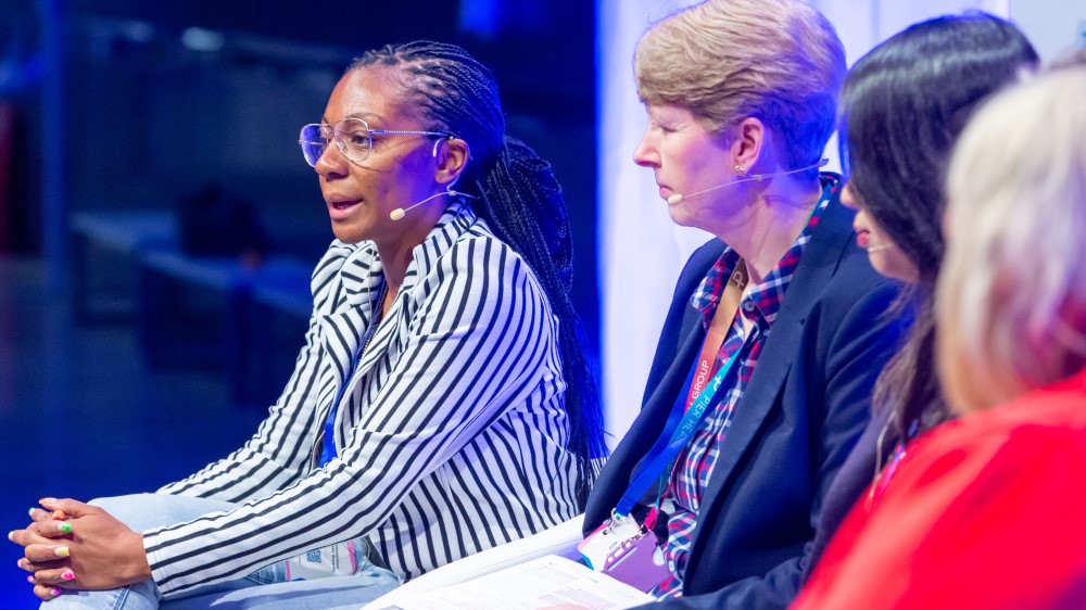 Photo shows Aisha Thomas of Representation Matters speaking at the Integrating Innovation conference