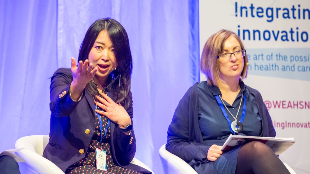 Photo shows Chen Mao Davies speaking at the Integrating Innovation conference