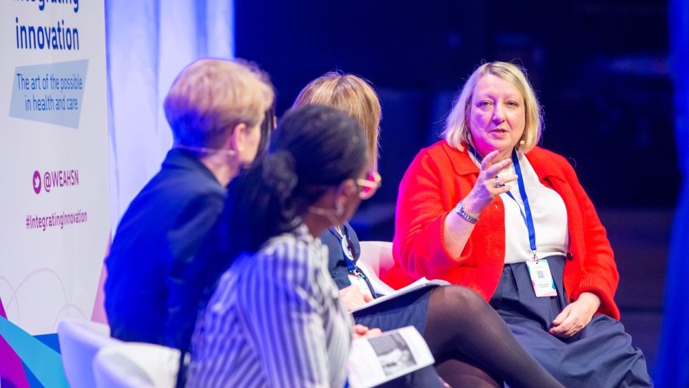 Photo shows Jane Moore speaking at the Integrating Innovation conference