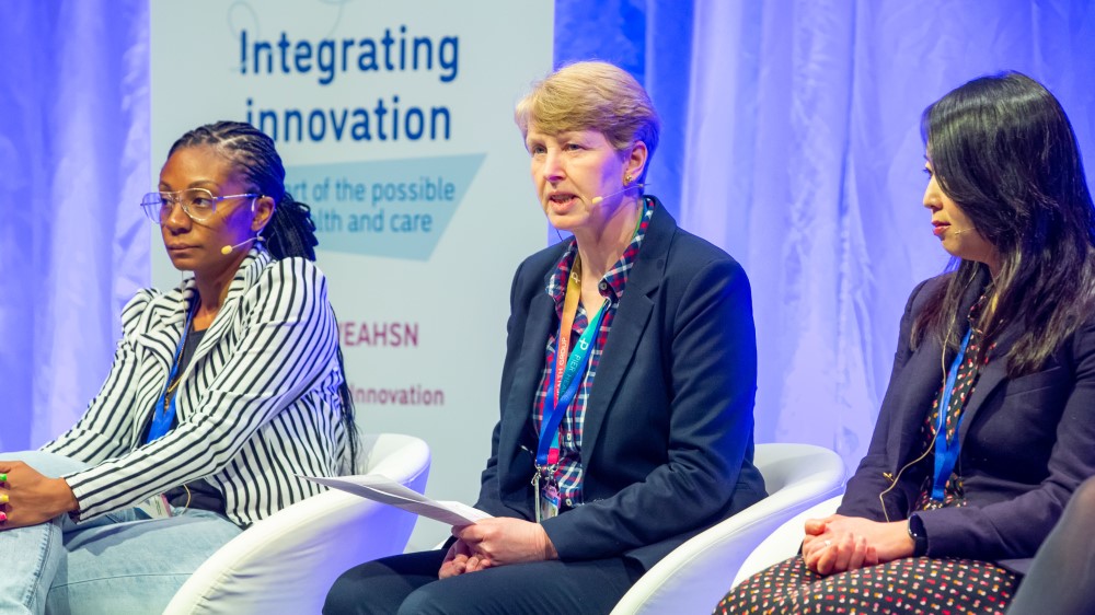 Photo shows Julie Davidson speaking at the Integrating Innovation conference