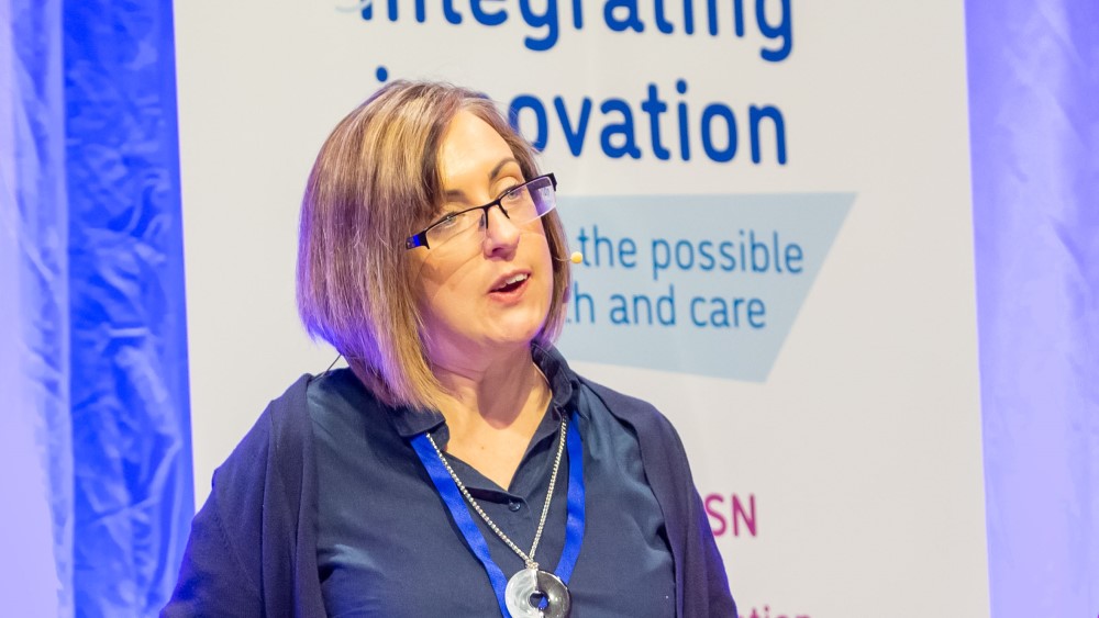 Photo shows Vicci Livingstone-Thompson speaking at the Integrating Innovation conference