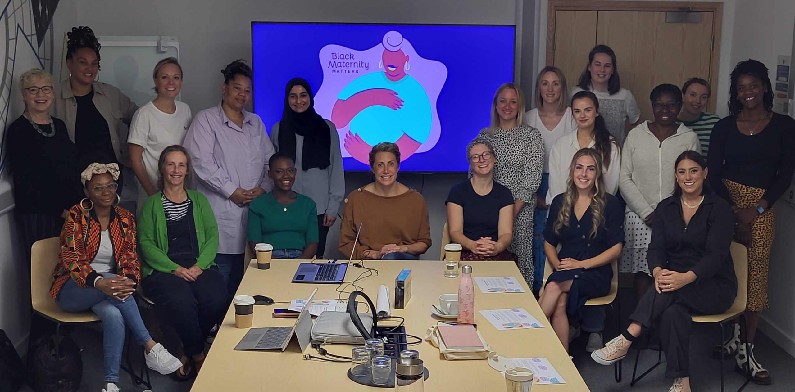 Photo shows members of the first Black Maternity Members pilot during a learning session